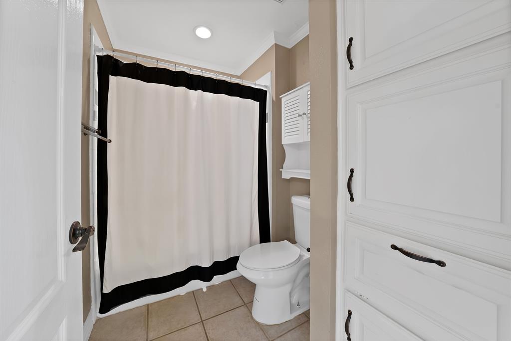 1110 McCampbell Road Mansfield, TX 76063 - Photo 22 of 39 a bathroom with a shower and a toilet