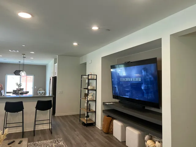 a kitchen with stainless steel appliances a stove and cabinets