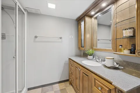 a bathroom with a sink and a mirror