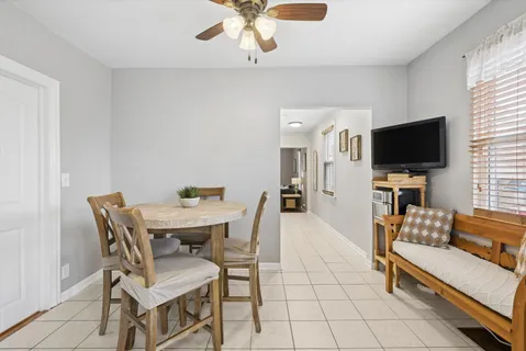 a view of a livingroom with furniture and a flat screen tv