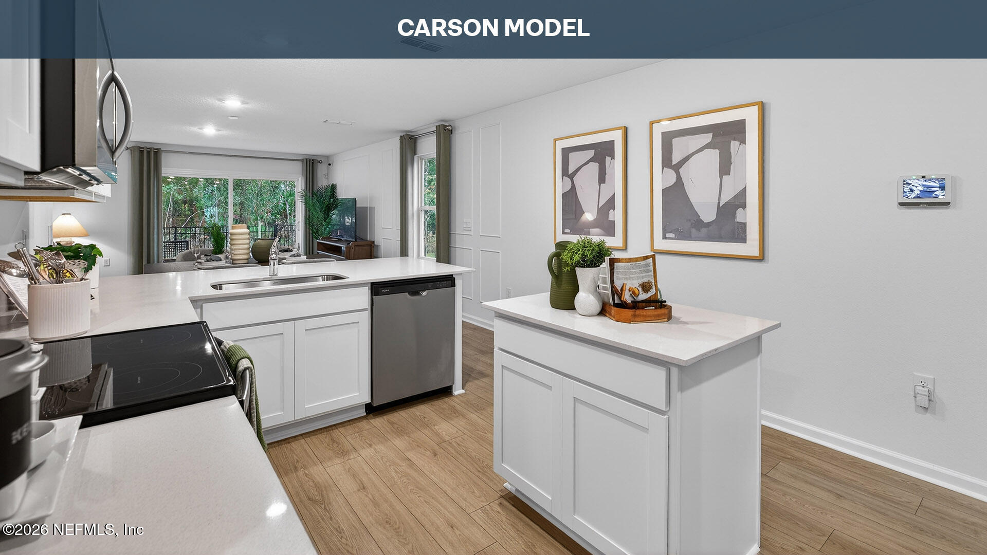 a kitchen with a sink cabinets and wooden floor