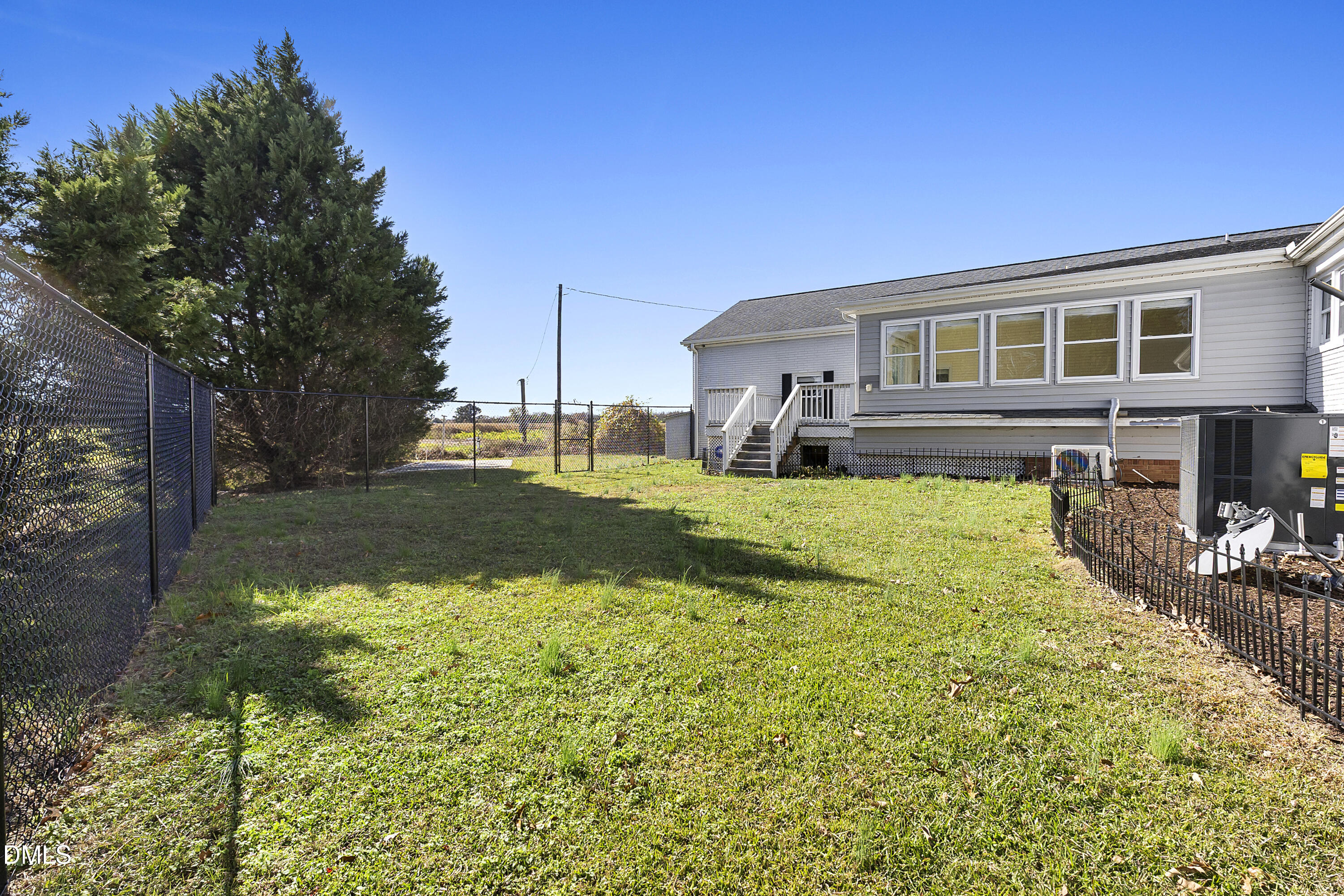 5575 Straw Pond School Road Godwin, NC 28344 - Photo 9 of 66 a front view of a house with a yard