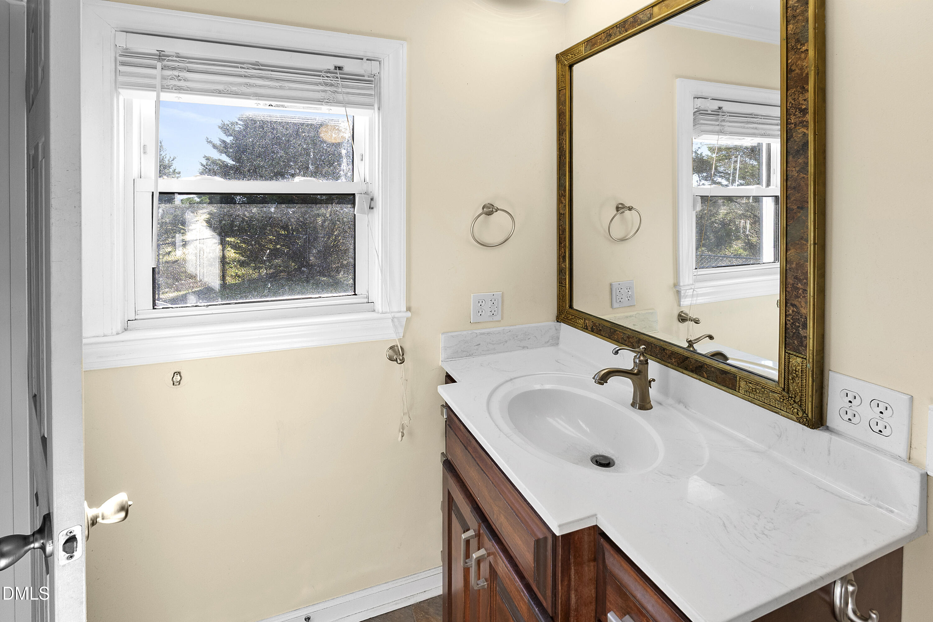 5575 Straw Pond School Road Godwin, NC 28344 - Photo 16 of 66 a bathroom with a sink and a large mirror