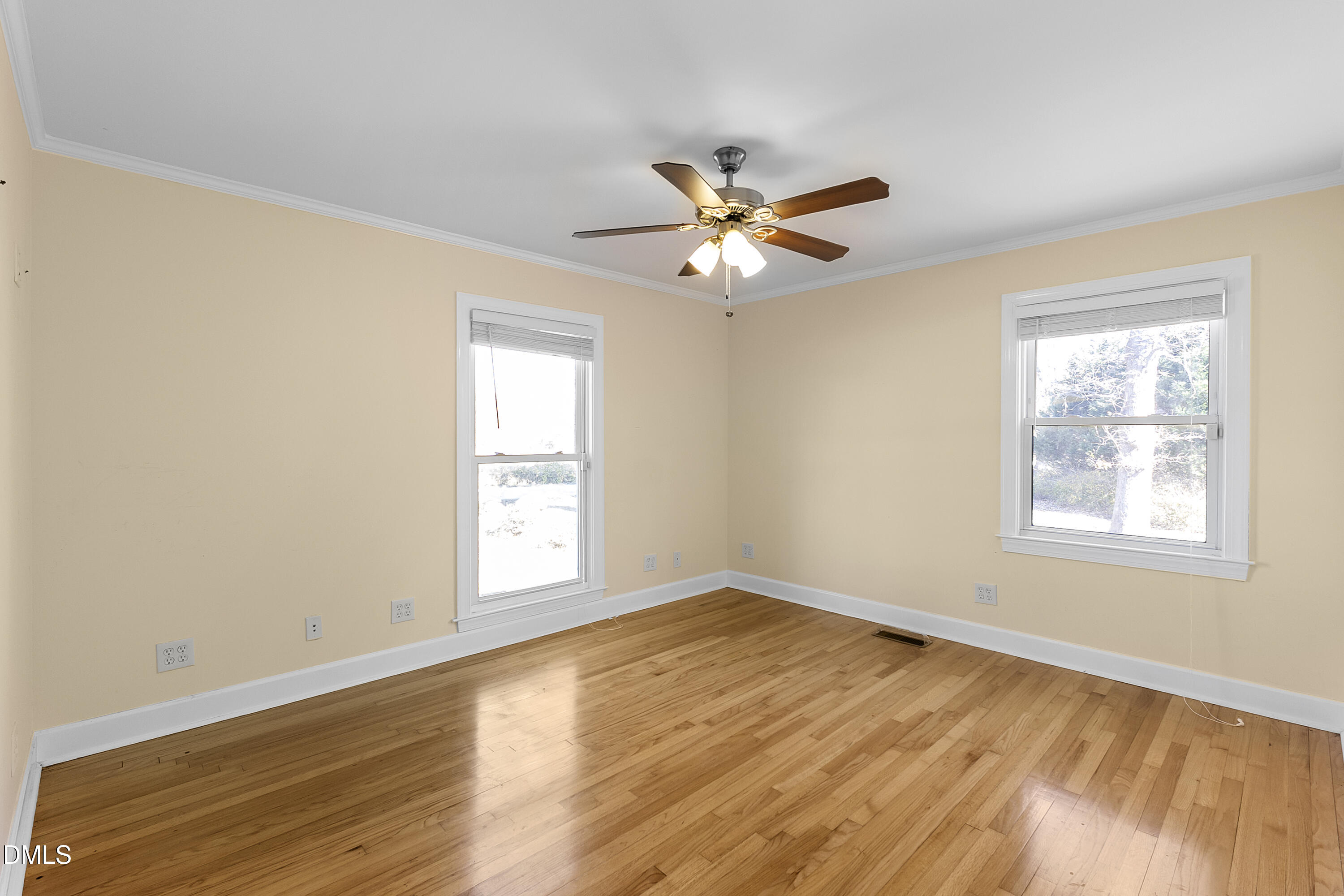 5575 Straw Pond School Road Godwin, NC 28344 - Photo 24 of 66 a view of empty room with wooden floor and fan