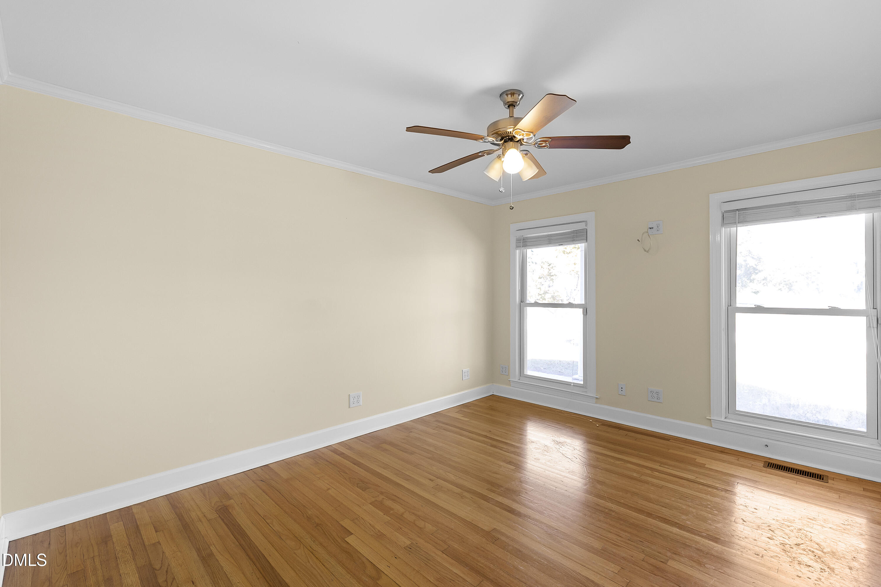 5575 Straw Pond School Road Godwin, NC 28344 - Photo 26 of 66 a view of empty room with wooden floor and fan