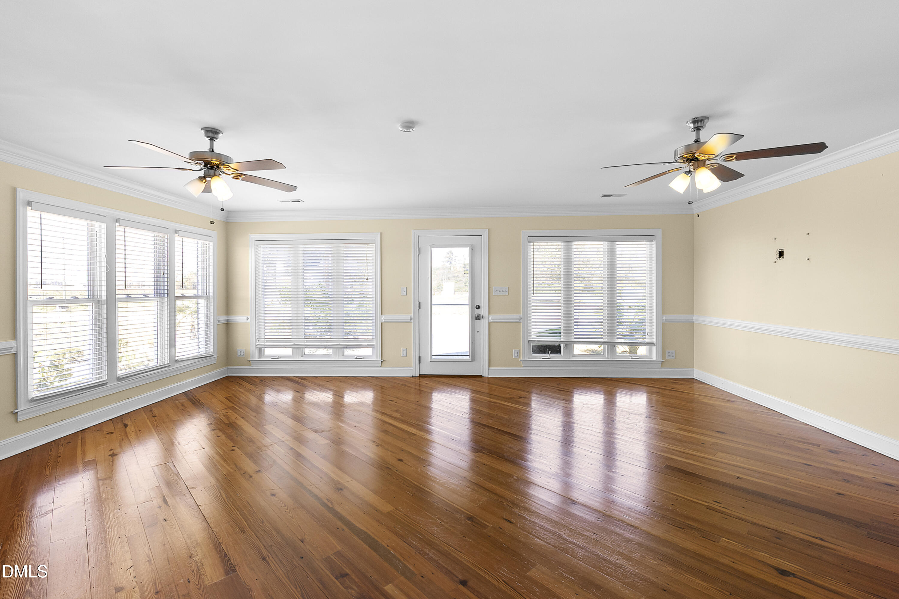 5575 Straw Pond School Road Godwin, NC 28344 - Photo 34 of 66 a view of an empty room with wooden floor and a window