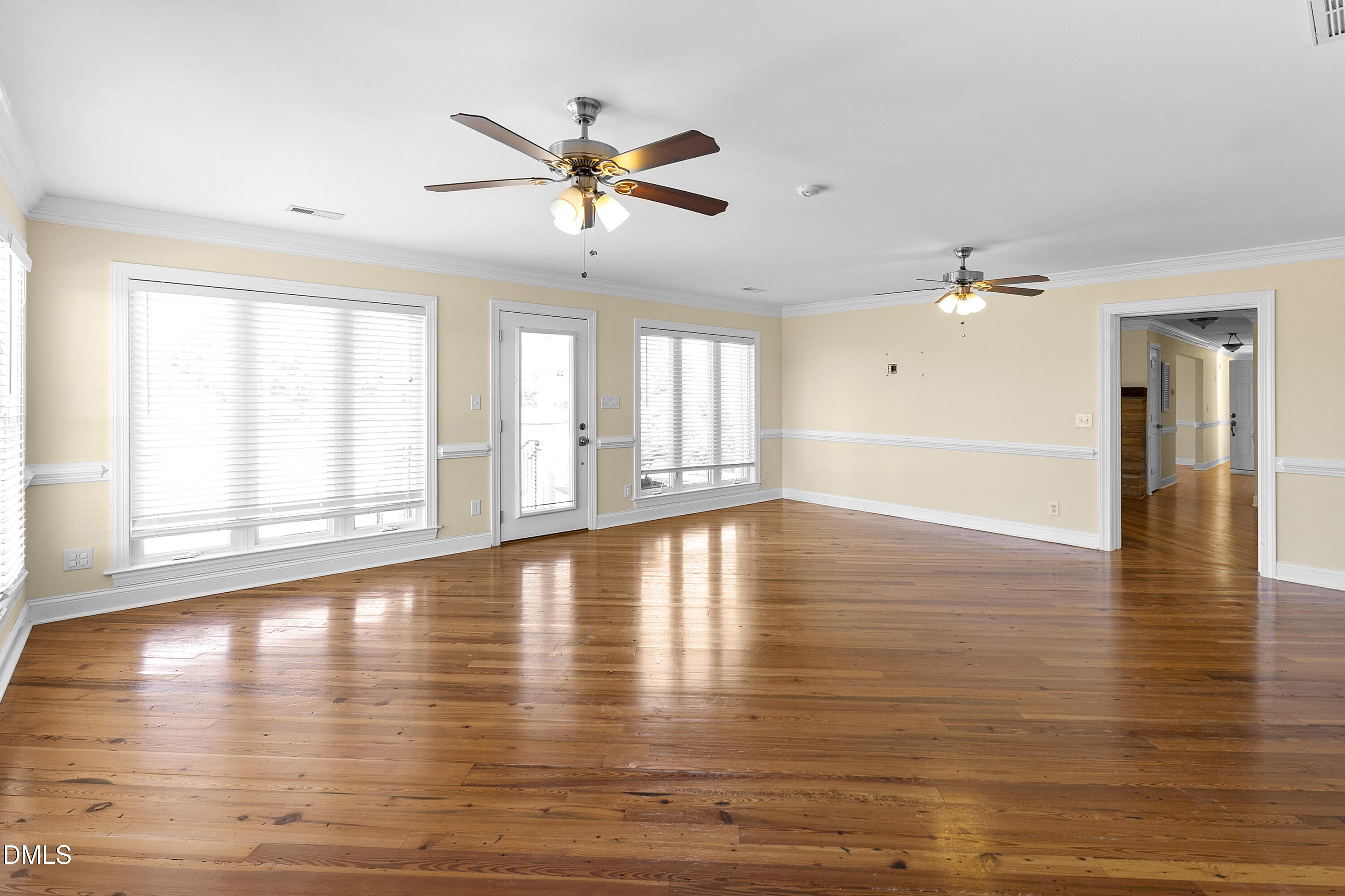 5575 Straw Pond School Road Godwin, NC 28344 - Photo 35 of 66 a view of an empty room with window and wooden floor