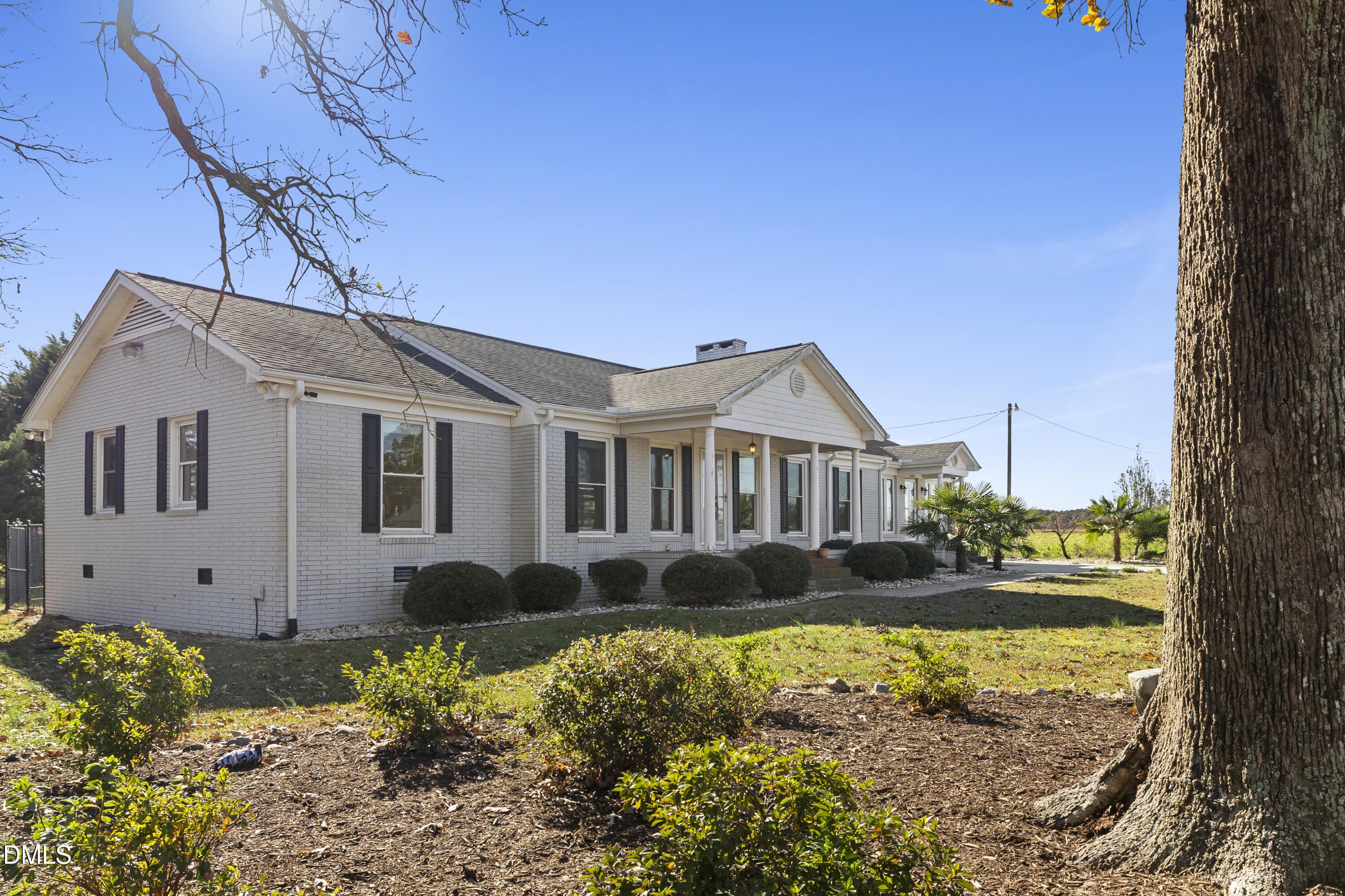5575 Straw Pond School Road Godwin, NC 28344 - Photo 4 of 66 a front view of a house with a garden