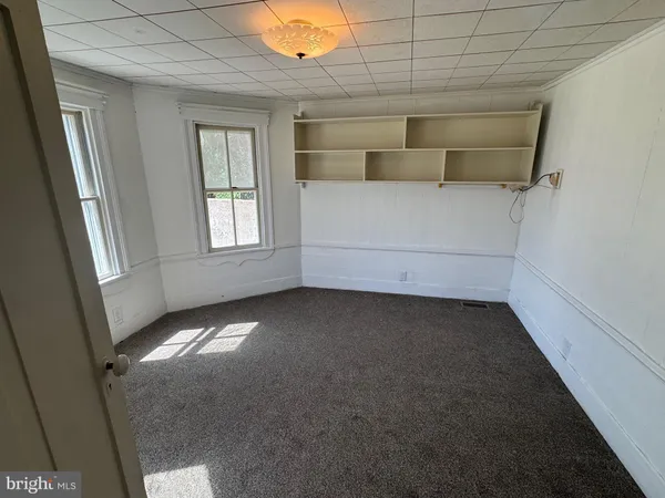 a view of an empty room and window