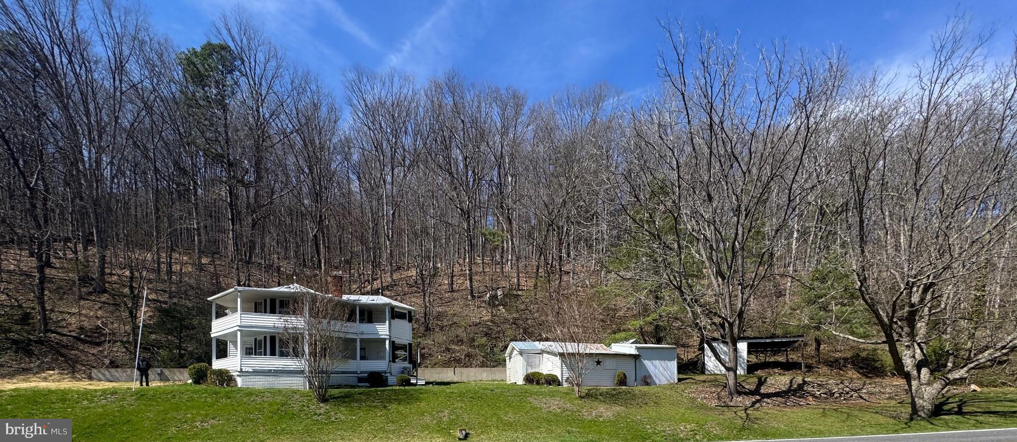 18250 South Fork Road Moorefield, WV 26836 - Photo 2 of 76 a terrace with a bench and trees