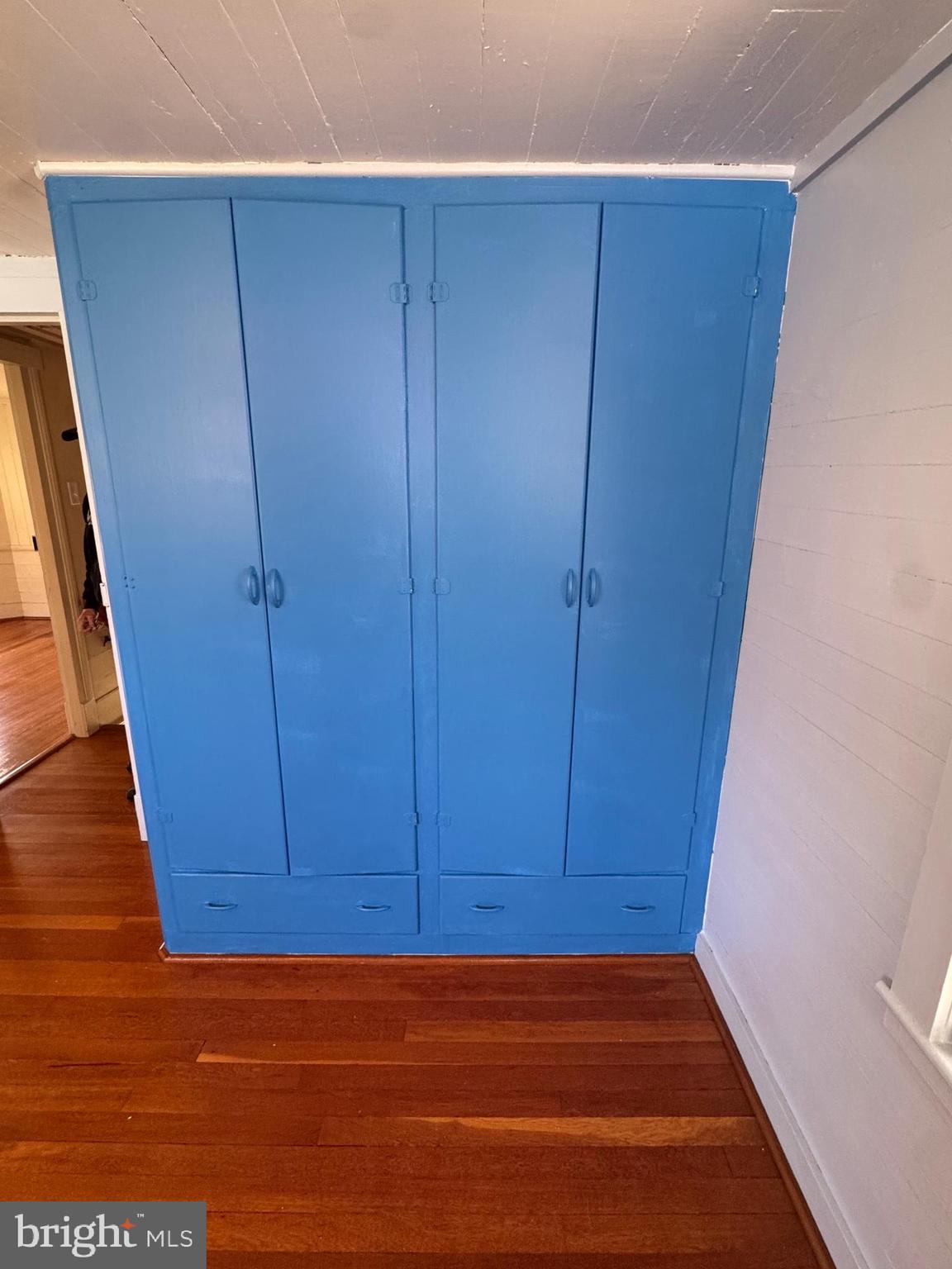 18250 South Fork Road Moorefield, WV 26836 - Photo 25 of 76 a view of room with walk in closet and wooden floor