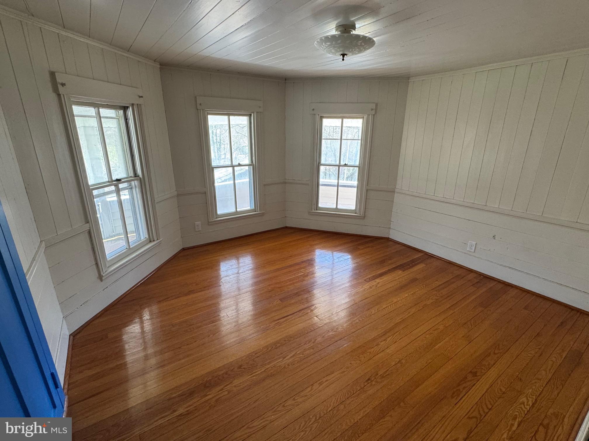 18250 South Fork Road Moorefield, WV 26836 - Photo 27 of 76 a view of an empty room with wooden floor and a window