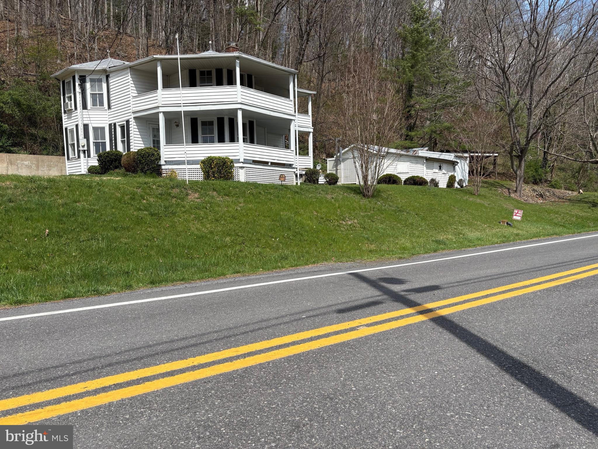 18250 South Fork Road Moorefield, WV 26836 - Photo 72 of 76 a front view of a house with a yard and sitting area