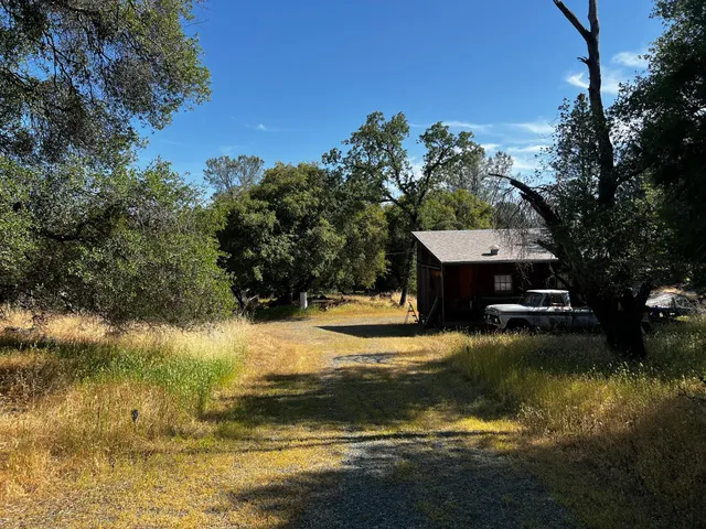 a view of a backyard of the house