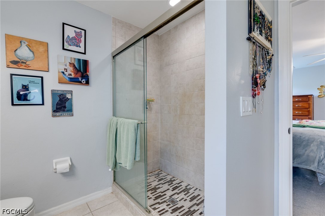 3801 28th Street Southwest Lehigh Acres, FL 33976 - Photo 20 of 37 a bathroom with a shower and toilet