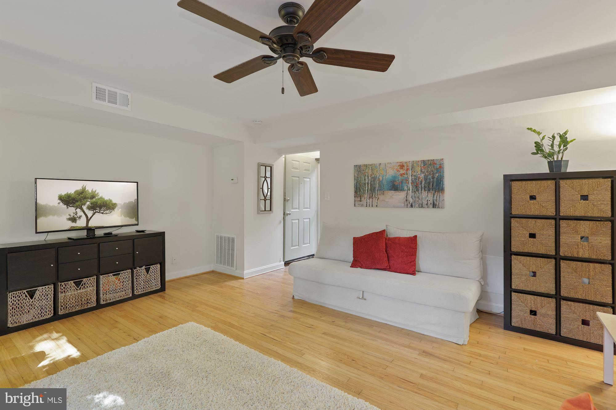8519 Bradford Road, Unit 62 Silver Spring, MD 20901 - Photo 10 of 25 Family Room with Refinished Hardwood Floors