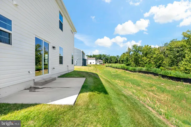 a view of a backyard with swimming pool