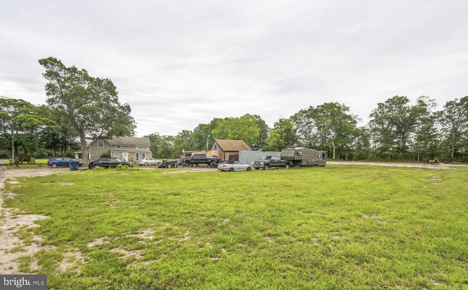 195 Simm Place Road Barnegat, NJ 08005 - Photo 2 of 7 a backyard of a house with lots of green space