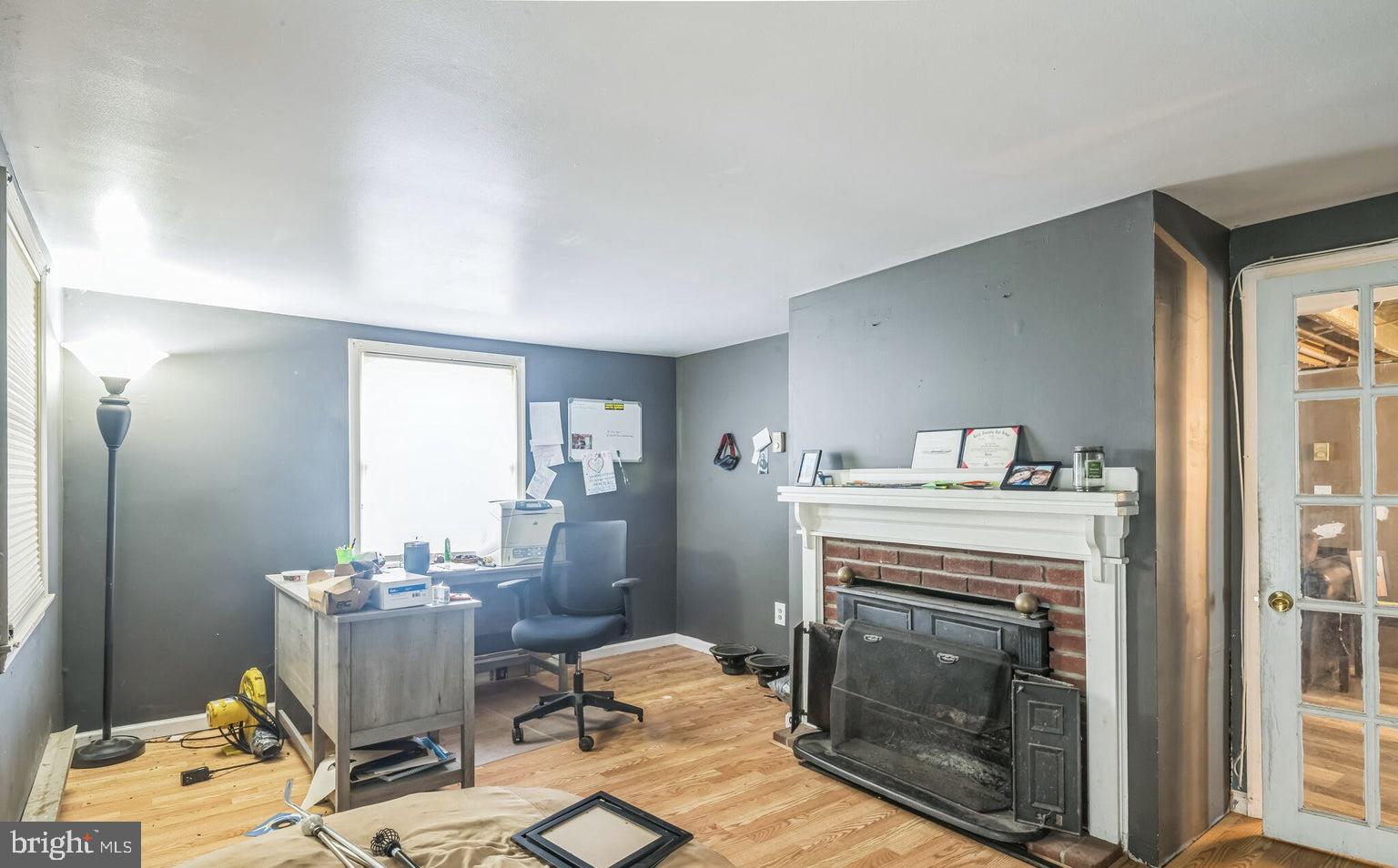195 Simm Place Road Barnegat, NJ 08005 - Photo 4 of 7 a living room with furniture and a fireplace