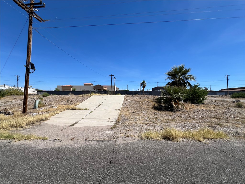 1692 Shamrock Road Bullhead City, AZ 86442 - Photo 5 of 11 The property features an existing paved driveway and a clear, level building area