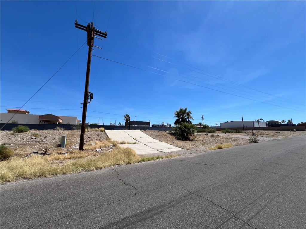 1692 Shamrock Road Bullhead City, AZ 86442 - Photo 6 of 11 This property features a paved road frontage and a concrete access ramp