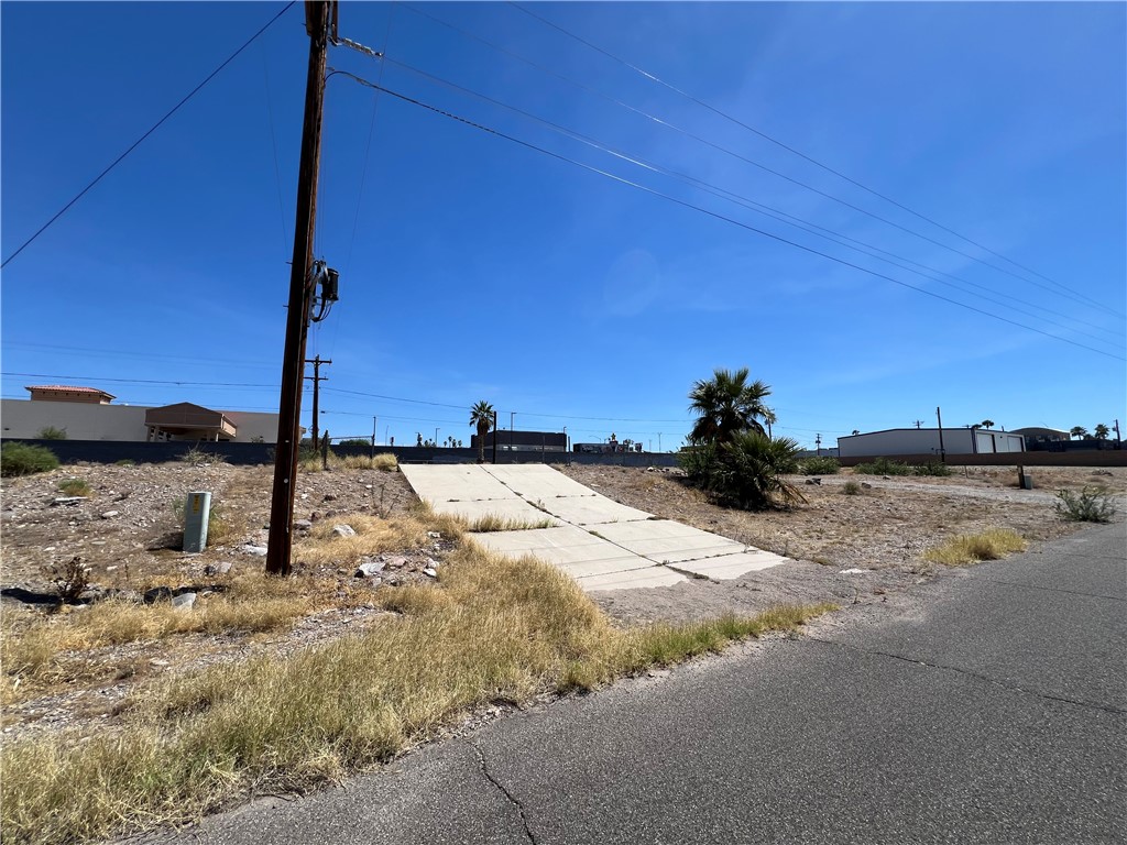 1692 Shamrock Road Bullhead City, AZ 86442 - Photo 7 of 11 The property features clear, open land with a small palm tree