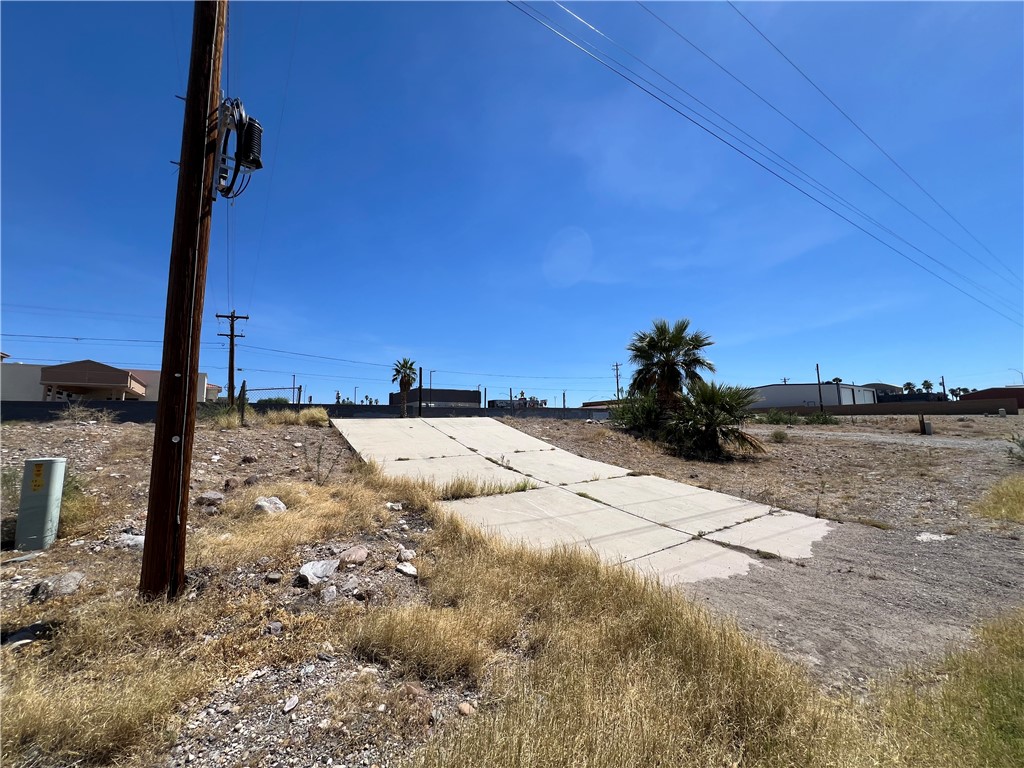 1692 Shamrock Road Bullhead City, AZ 86442 - Photo 8 of 11 This property features a clear, sunny sky and a concrete surface