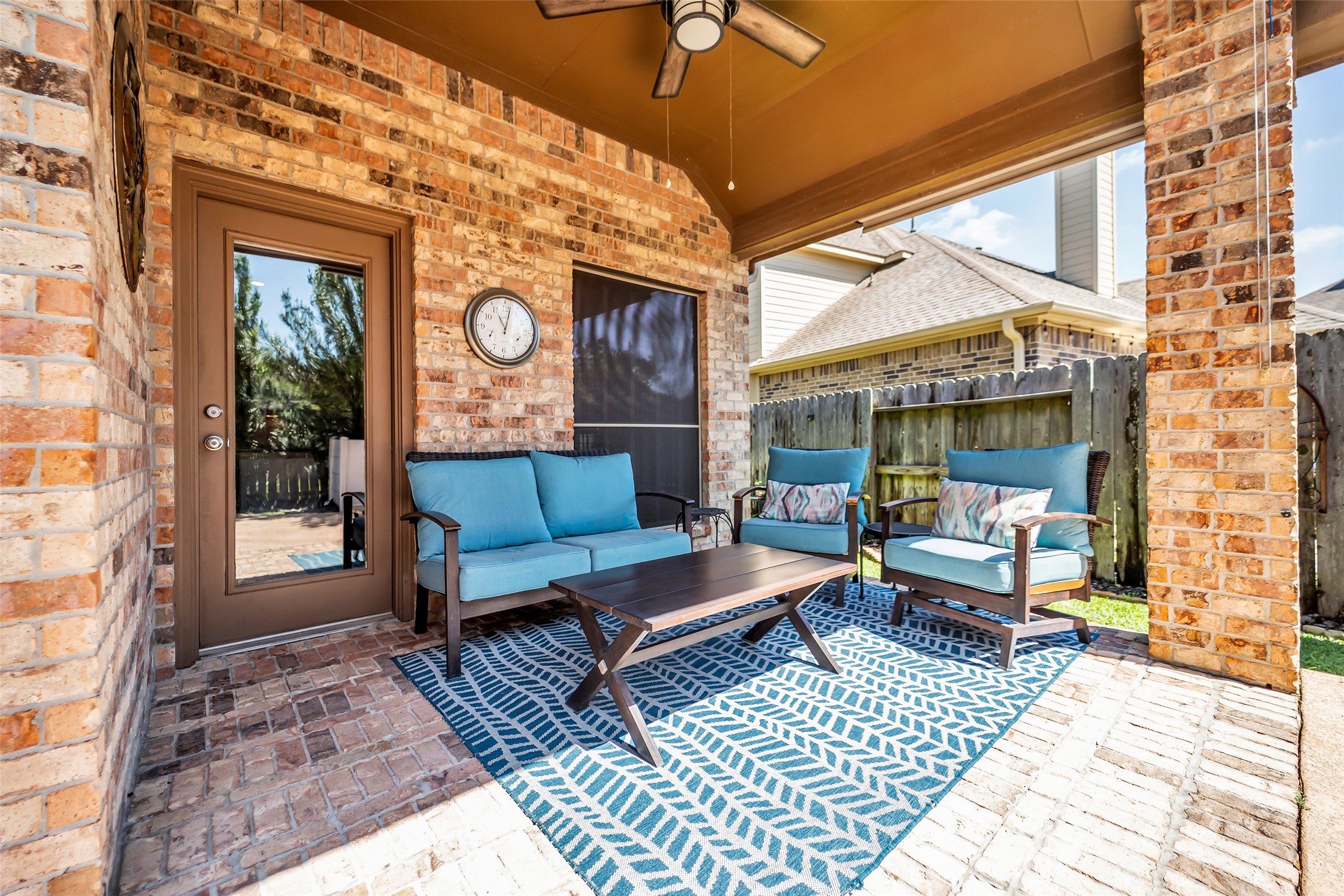 12006 Bayou Junction Road Cypress, TX 77433 - Photo 26 of 38 Covered outdoor patio area; solar screens and ceiling fans are already in place! ALL BRICK!