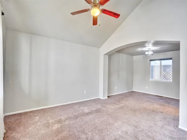 a view of an empty room with a window