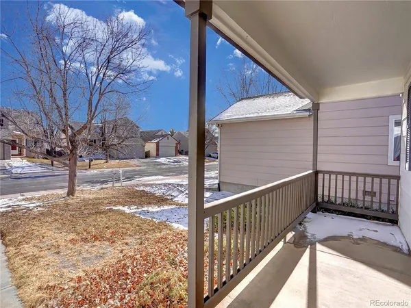 a view of a yard with wooden fence