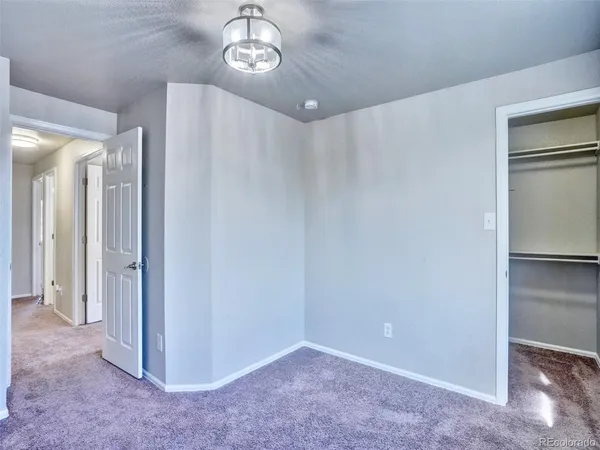 a view of a hallway with closet area