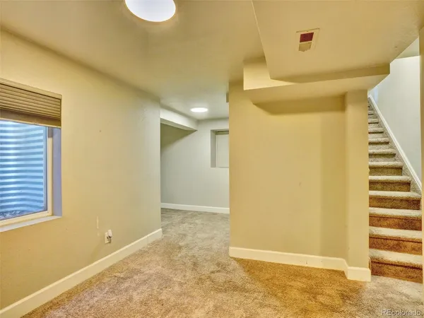 a view of a room with a staircase