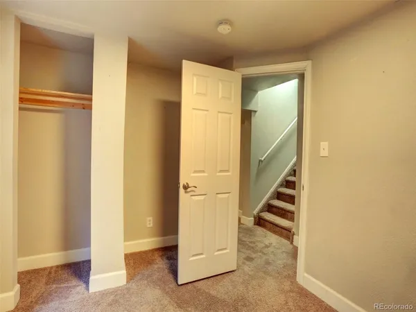 a view of a hallway with staircase