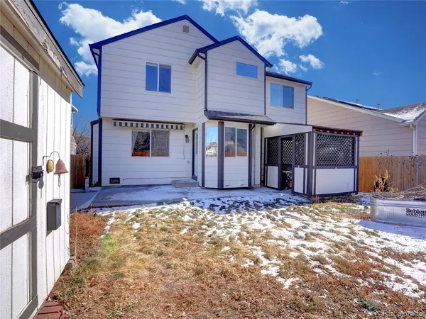 a view of a house with a snow in the yard