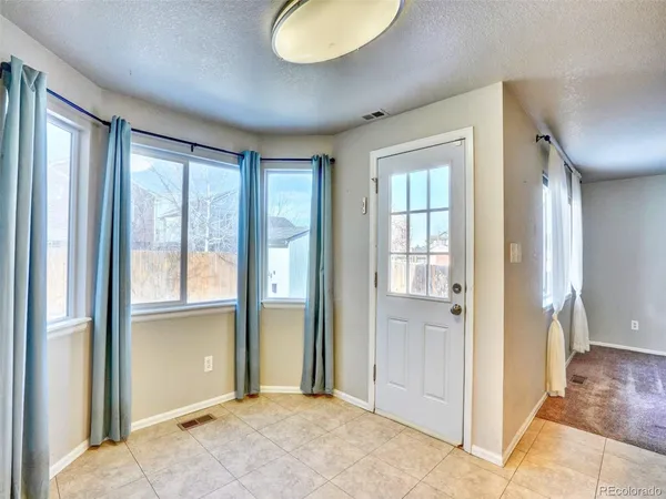 wooden floor and windows in an empty room