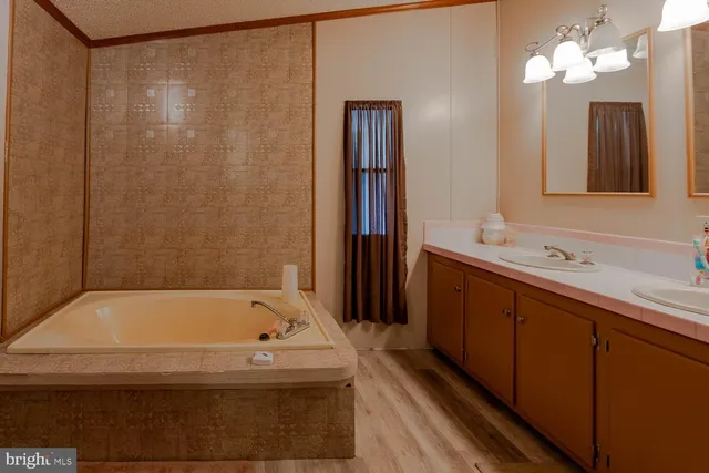 a bathroom with a bathtub and a sink