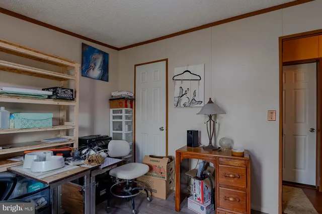 a view of a workspace with furniture