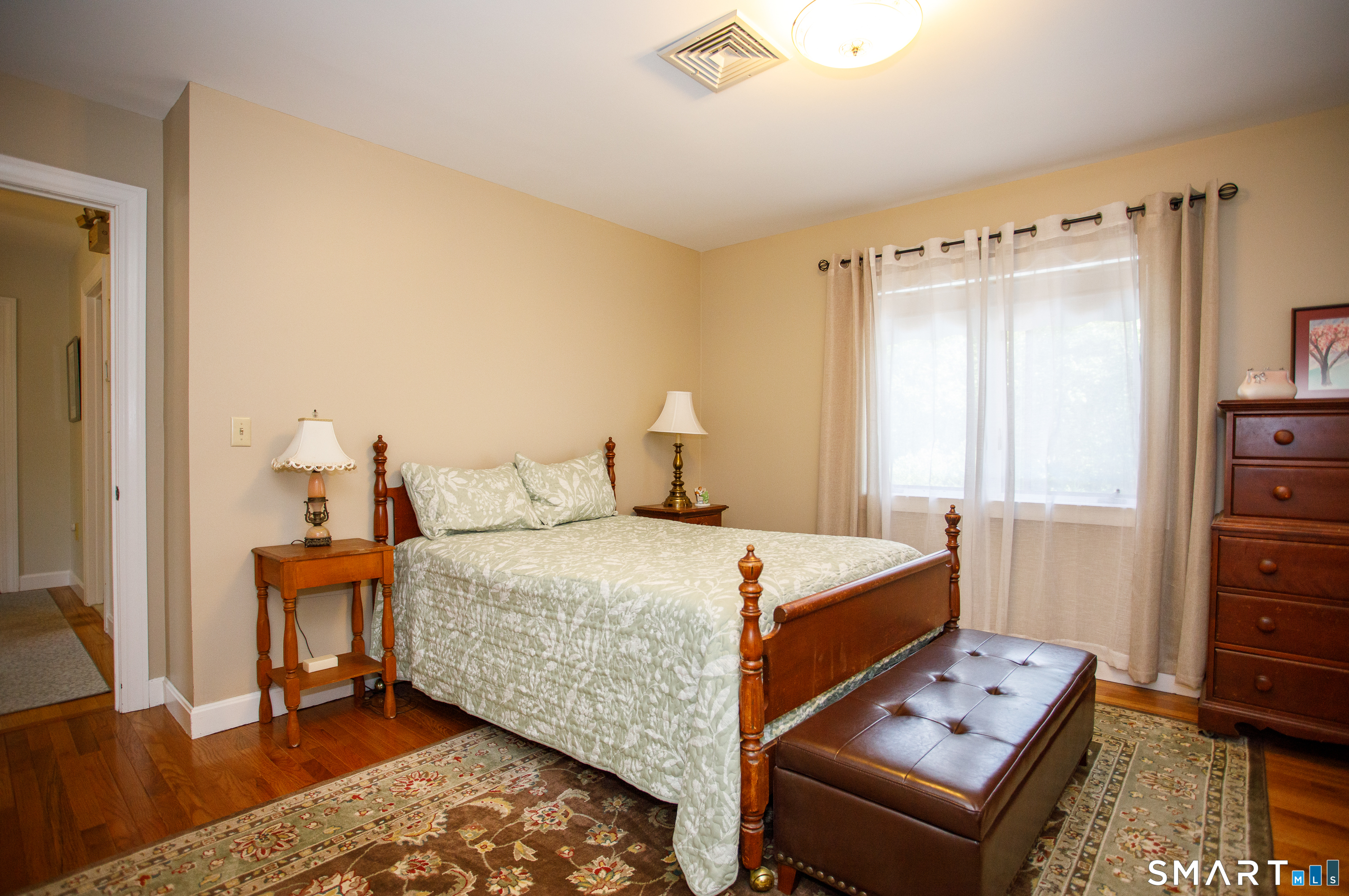 25 Stony Ridge Road Norwich, CT 06360 - Photo 28 of 40 a bedroom with a bed and wooden floor