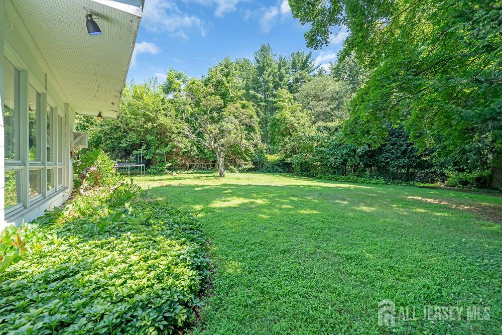21 Homestead Lane Roosevelt, NJ 08555 - Photo 23 of 24 a view of a grassy field with trees