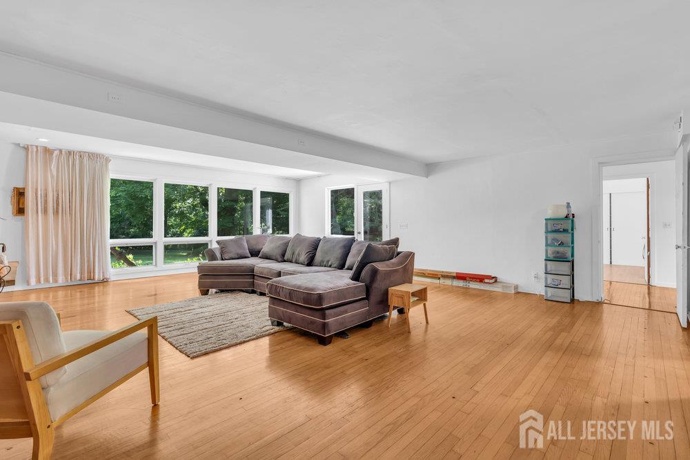 21 Homestead Lane Roosevelt, NJ 08555 - Photo 3 of 24 a living room with furniture and a large window