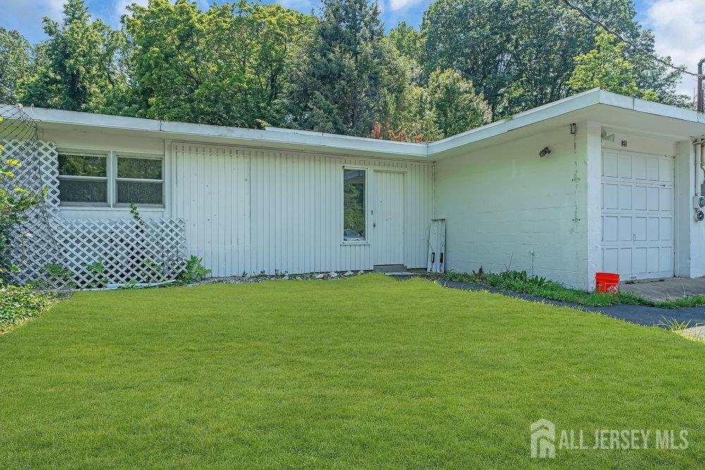 21 Homestead Lane Roosevelt, NJ 08555 - Photo 4 of 24 a backyard of a house with lots of green space