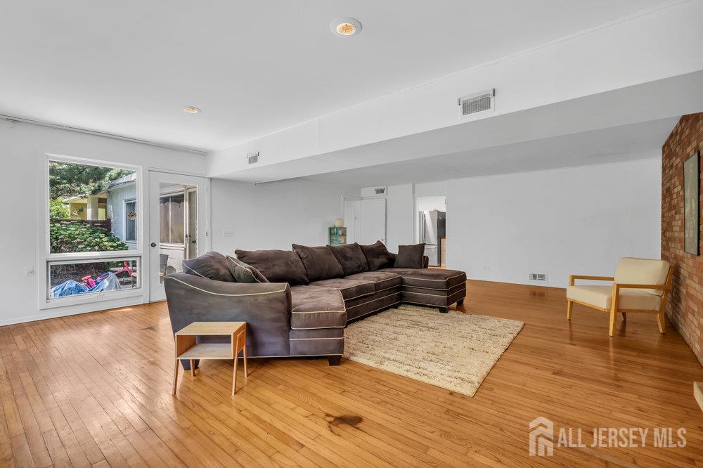 21 Homestead Lane Roosevelt, NJ 08555 - Photo 10 of 24 a living room with furniture and a wooden floor
