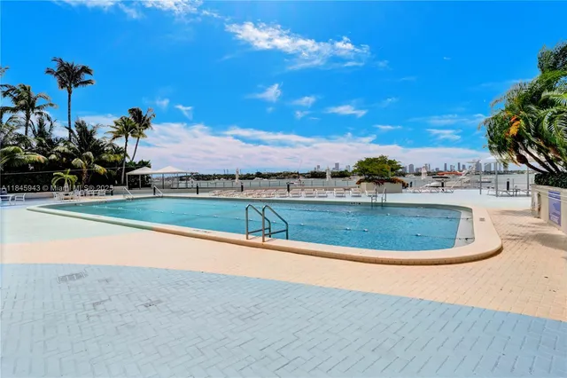 a view of a house with a swimming pool and a yard