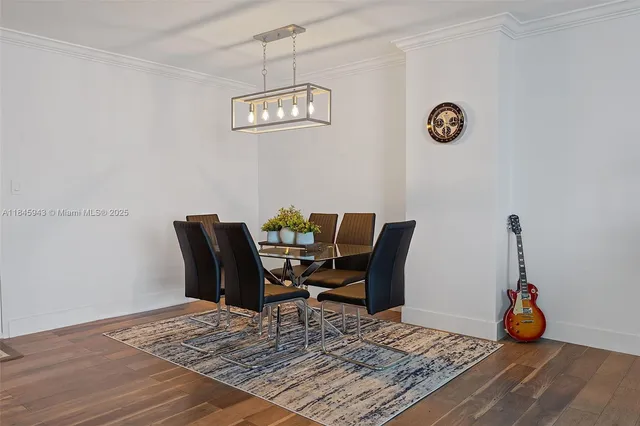 a view of a workspace with furniture and wooden floor