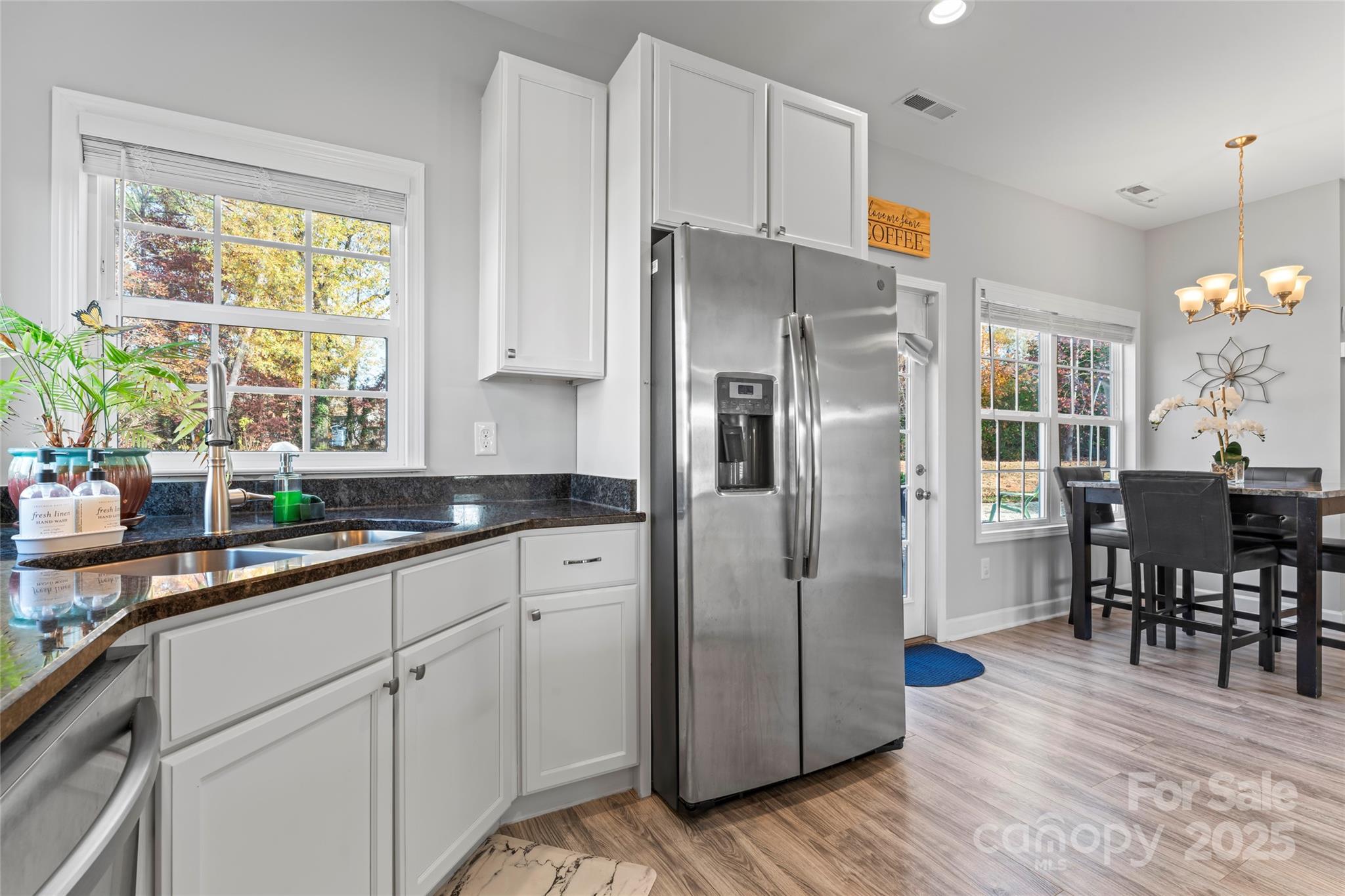3839 Robinson Circle Gastonia, NC 28056 - Photo 16 of 46 a kitchen with stainless steel appliances a refrigerator sink and cabinets