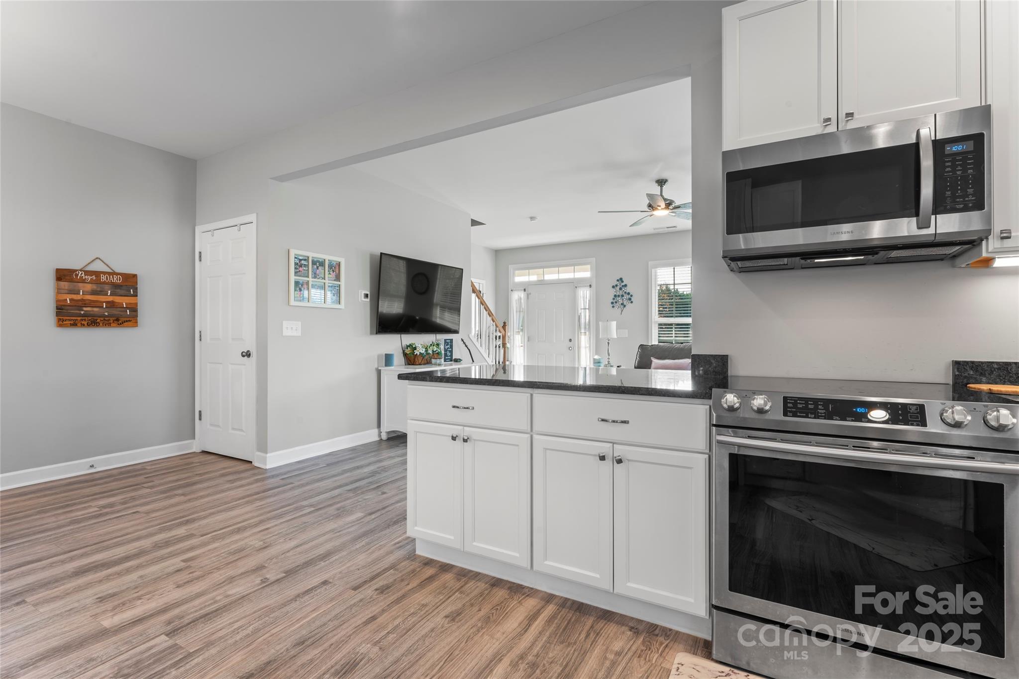 3839 Robinson Circle Gastonia, NC 28056 - Photo 17 of 46 a kitchen with a stove and a microwave