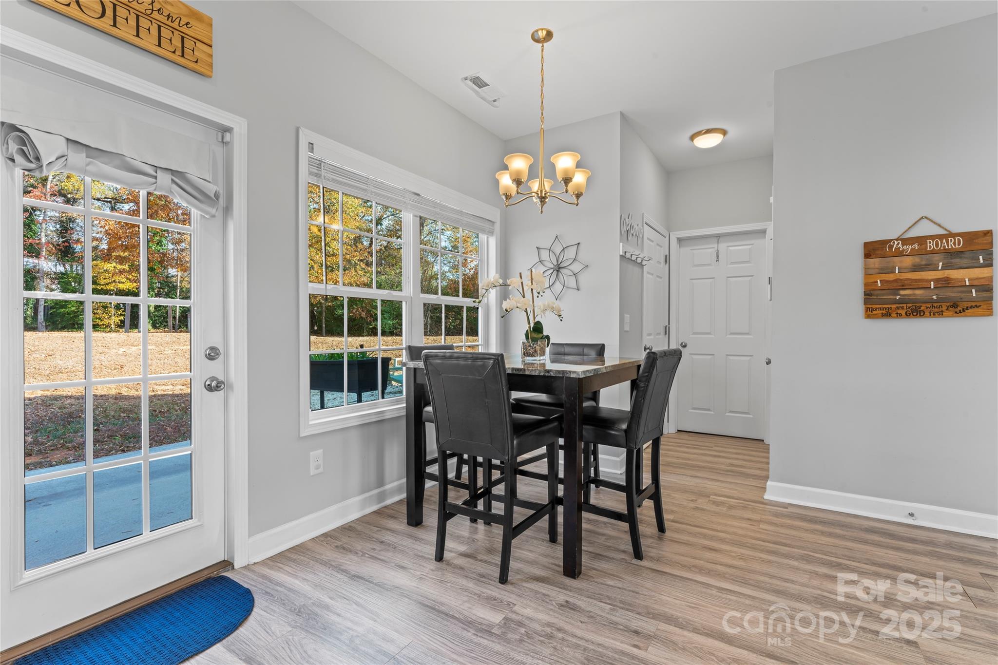 3839 Robinson Circle Gastonia, NC 28056 - Photo 18 of 46 a view of a dining room with furniture window and wooden floor