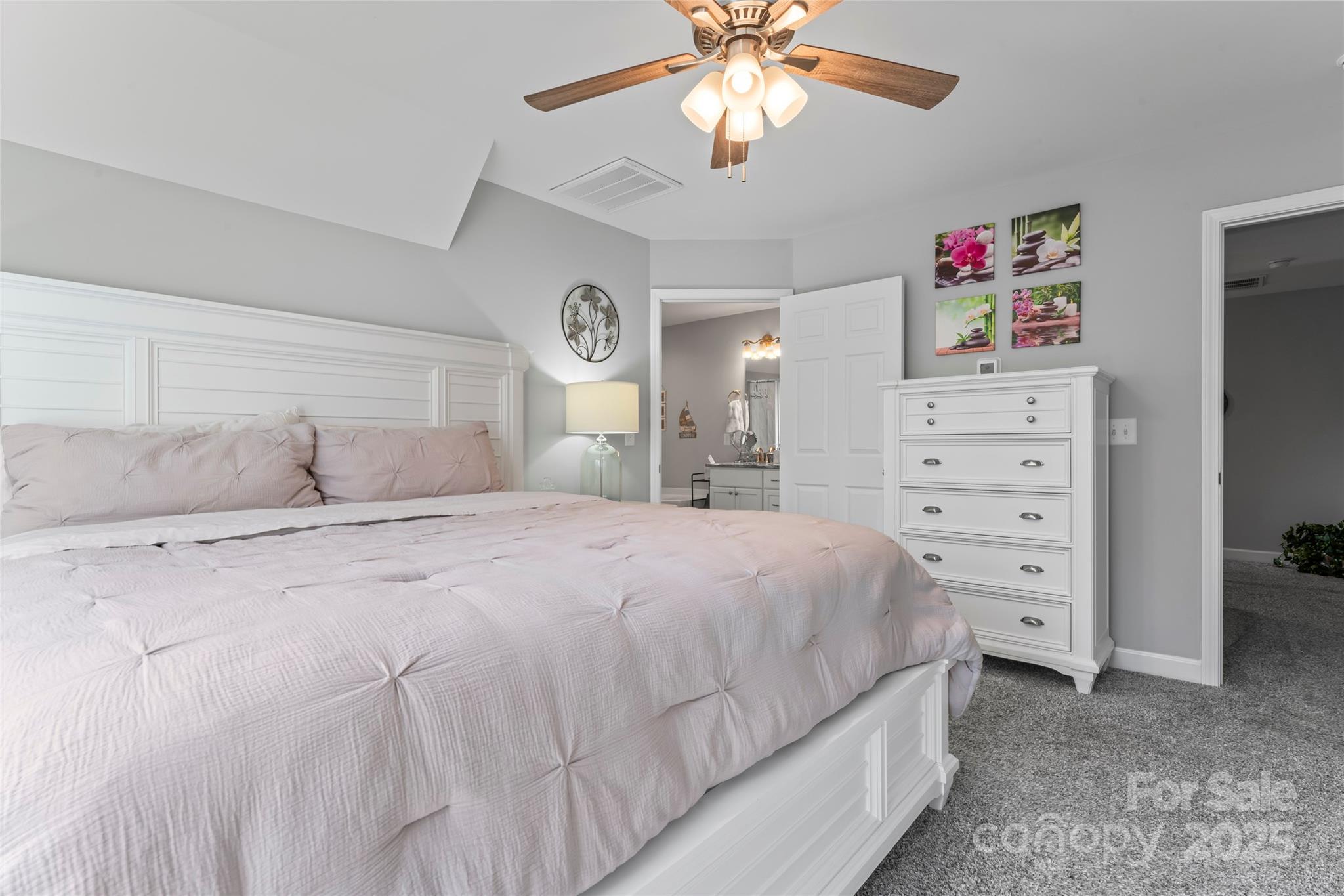 3839 Robinson Circle Gastonia, NC 28056 - Photo 23 of 46 a bedroom with a bed and a chandelier