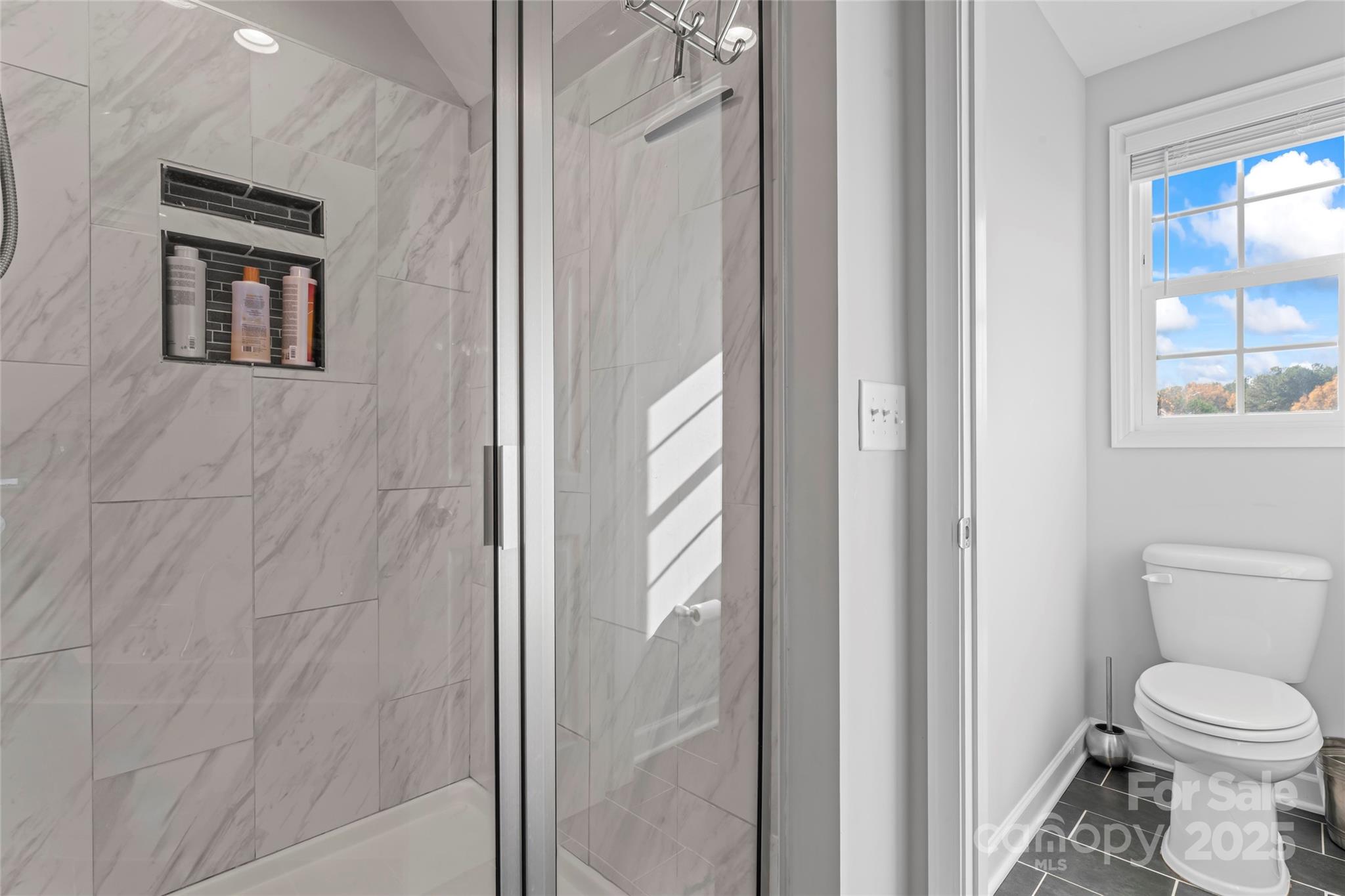 3839 Robinson Circle Gastonia, NC 28056 - Photo 26 of 46 a bathroom with a toilet and a shower