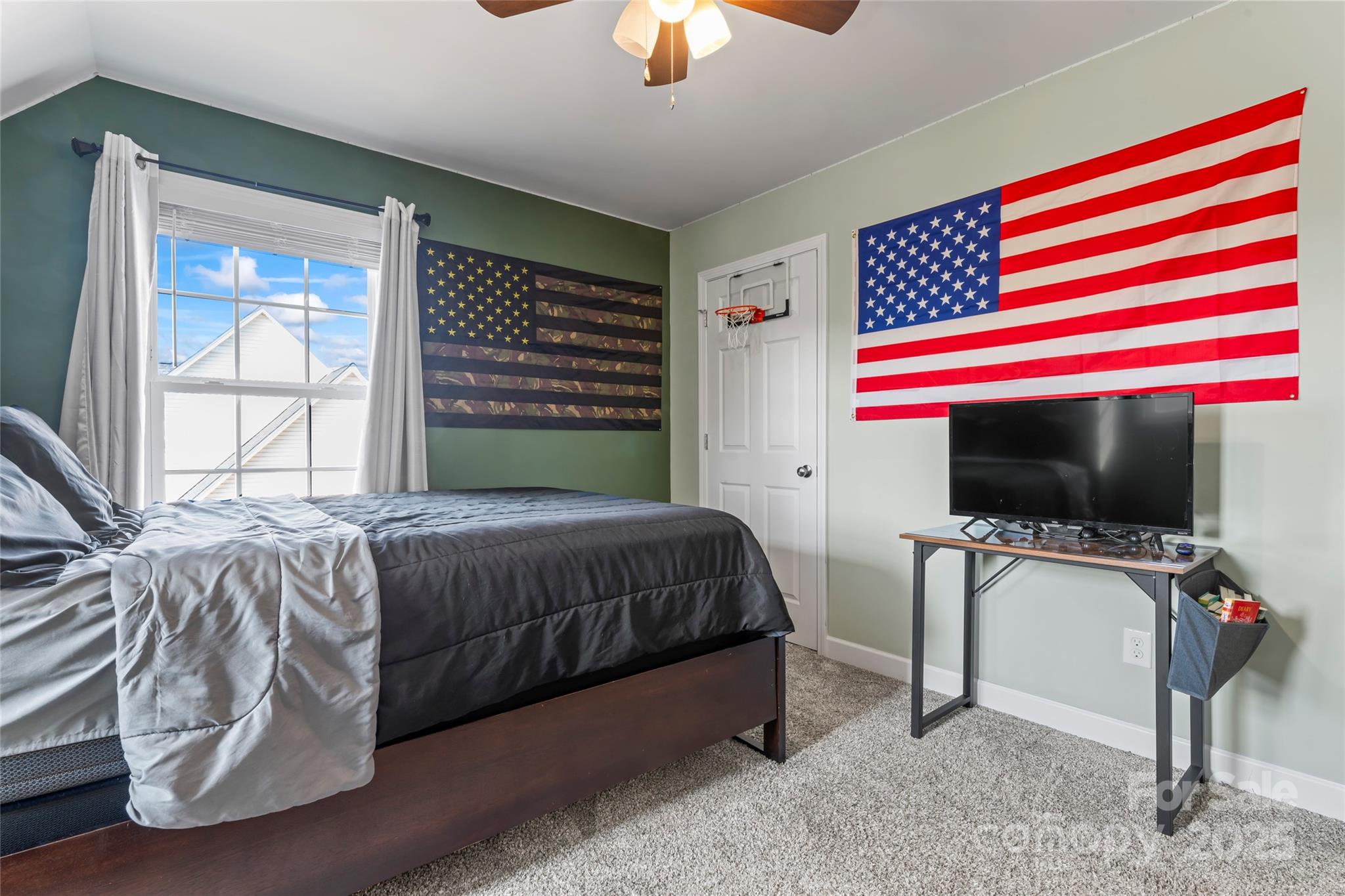 3839 Robinson Circle Gastonia, NC 28056 - Photo 31 of 46 a bedroom with a bed and a flat screen tv